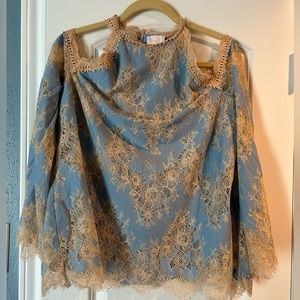 Light blue lace overlay, long sleeve shirt.